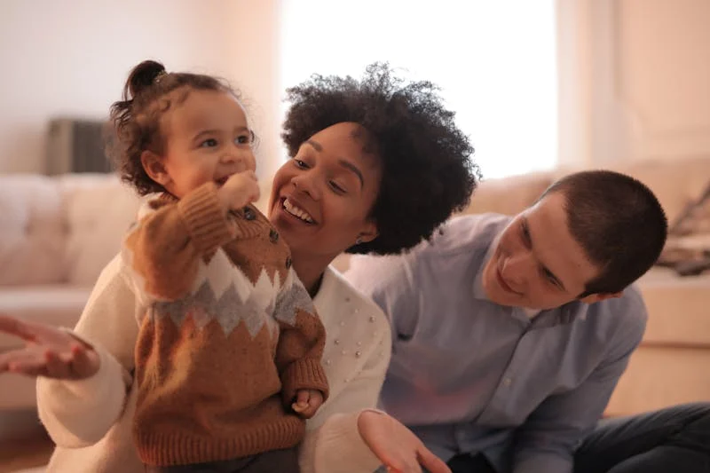 2 adults and toddler laughing Introducing a New Partner to Your Children