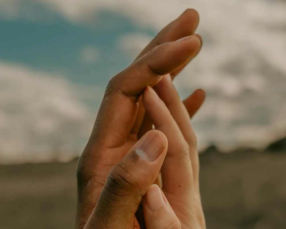 Hands touching showing trust in another person